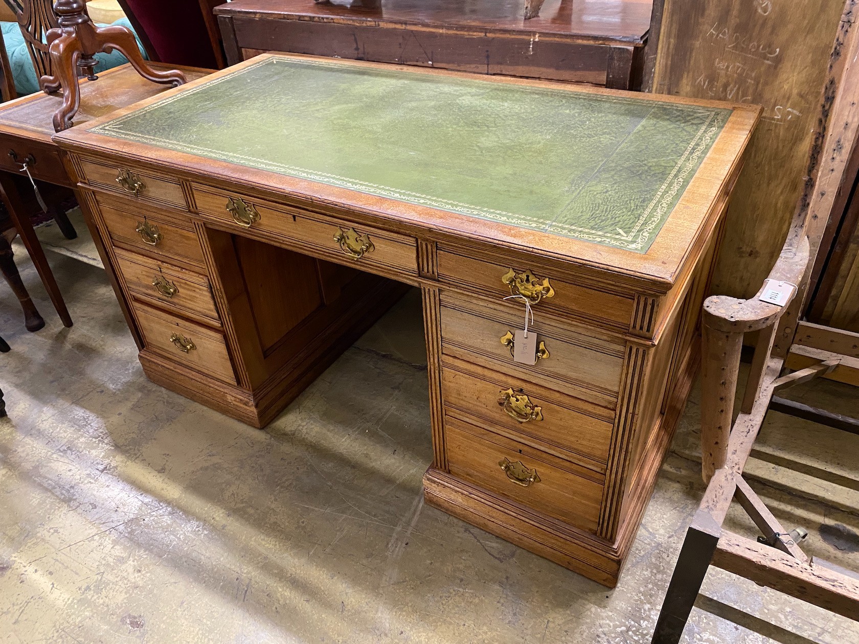 A late Victorian mahogany kneehole desk, length 137cm, depth 74cm, height 73cm